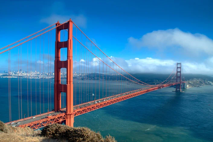 Here, the left tower of the bridge is closer to the center of the frame to balance out the "smaller" tower that is further out on the right